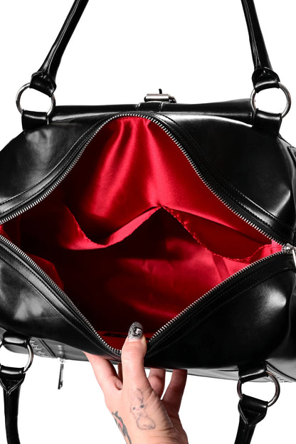 Detalle de los bolsillos y correa ajustable del Umbra Travel Bag de FOXBLOOD