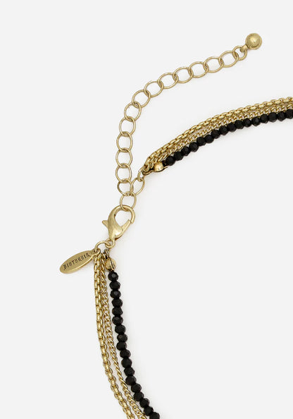 Collar en capas de luna y polilla doradas